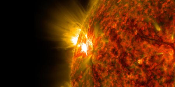 An active region on the sun emits a solar flare