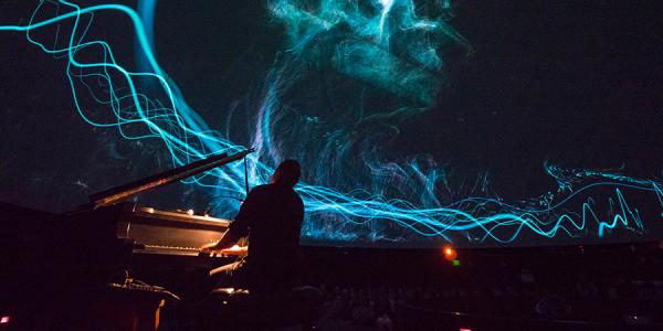 Roman Zavada performs live footage of the Aurora Borealist at Fiske Planetarium